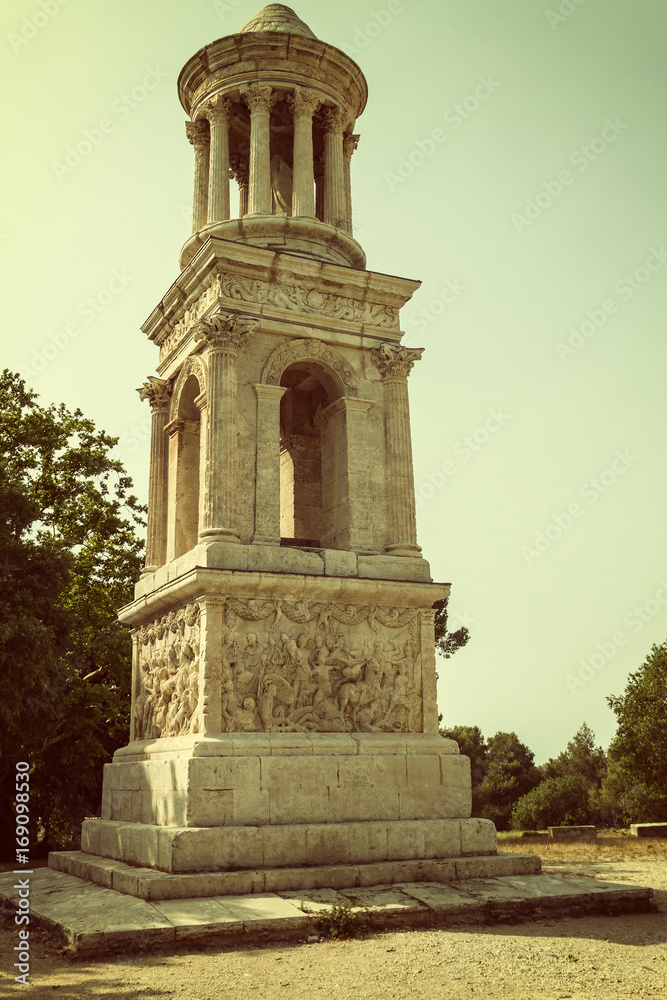 The Mausoleum of the Julii at Glanum near Saint-Rémy de Provence (France). Edited as a vintage photo with dark edges.
