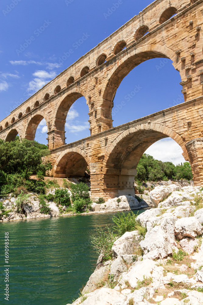 The Pont du Gard crosses the Gardon River in South France. Vertically.