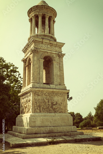 The Mausoleum of the Julii at Glanum near Saint-Rémy de Provence (France). Edited as a vintage photo with dark edges. photo