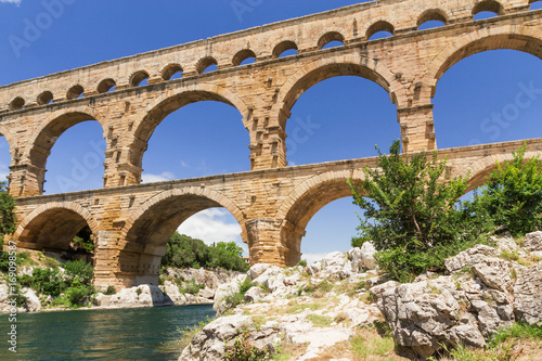 The Pont du Gard is an ancient Roman aqueduct that crosses the Gardon River in South France. Horizontally.