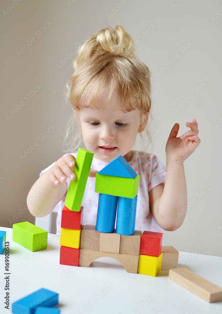 Caucasian Girl Playing with Wooden Colorful Cubes at Home Early Education Preparing for School Development Caucasian Girl Playing with Wooden Colorful Cubes at Home Early Education Preparing for School Development