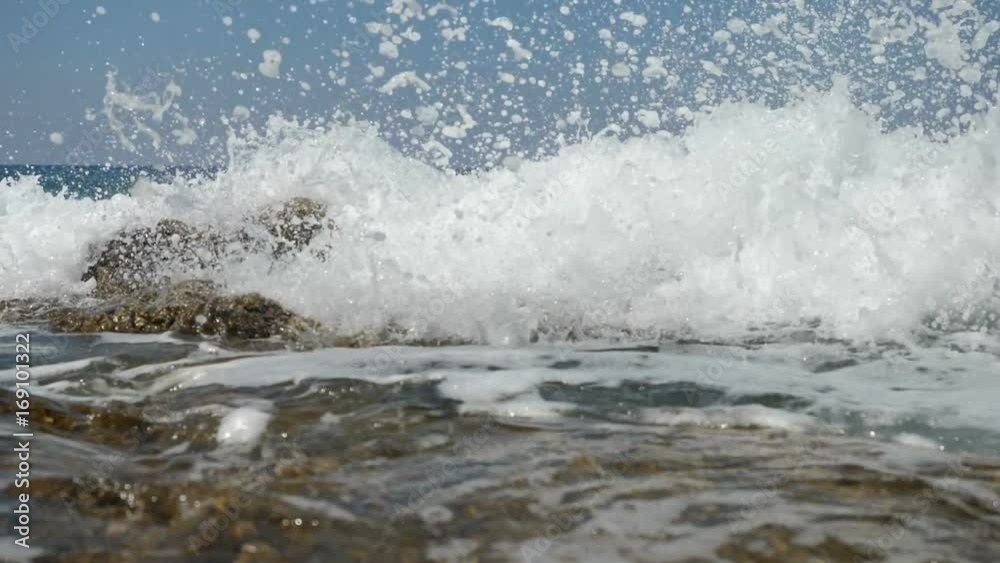 Sea waves crashing on stone beach - slow motion.
Sea waves crashing on stone beach - slow motion.