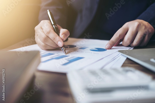 Professional business woman working with calculator, Doing finance on laptop, document graph and analysis business strategy to development profit © Freedomz
