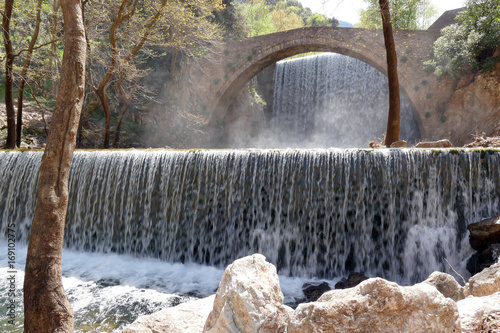 Waterfall - Arcade Bridge Palaiokarya, Prefecture of Trikala, Greece. photo