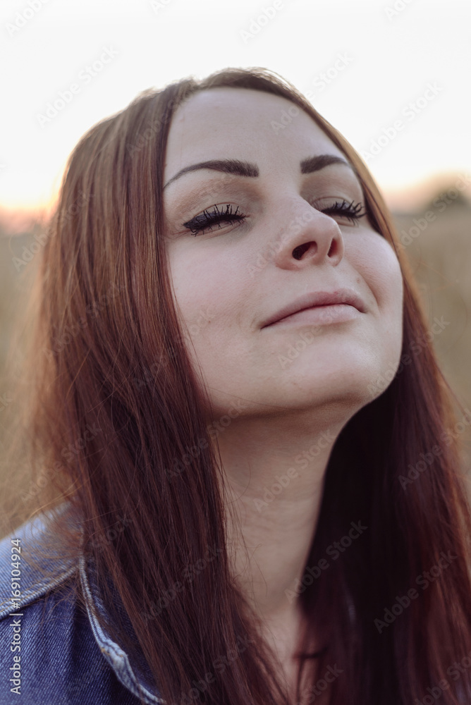 Portrait of happy young beautiful woman brunette in field wheat sunset evening Portrait of happy young beautiful woman brunette in field wheat sunset evening