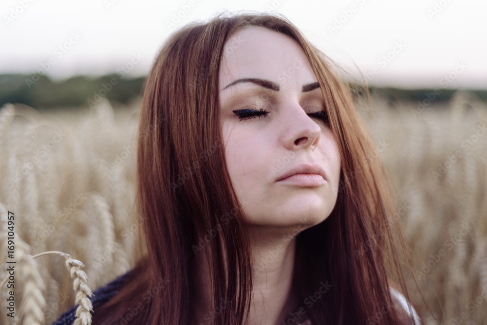 Portrait of happy young beautiful woman brunette in field wheat sunset evening Portrait of happy young beautiful woman brunette in field wheat sunset evening