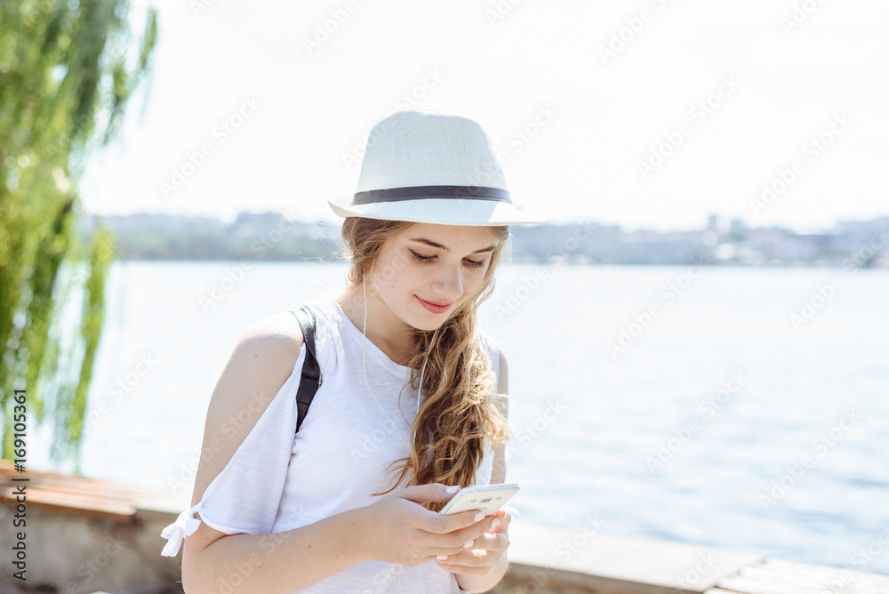 woman with smartphone listening to music