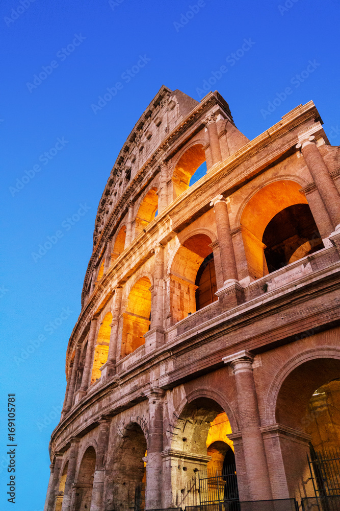 Colosseum at night vertical photo