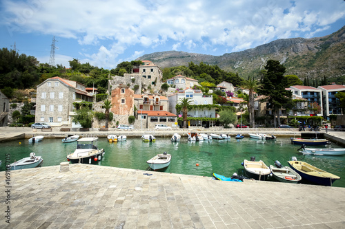 Boats anchored at pier at Dubrovnik riviera in Mlini, Croatia. photo