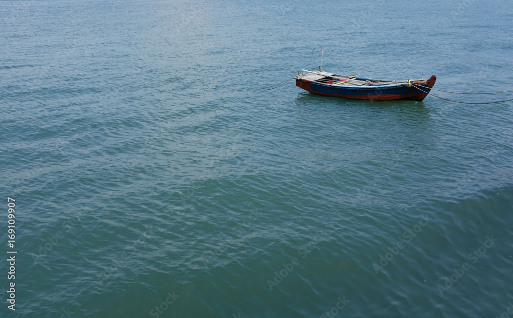 a boat floating on the sea, Tongyeong-si, South Korea a boat floating on the sea, Tongyeong-si, South Korea