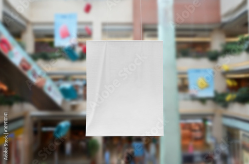 Vertical banner mockup at a shopping mall