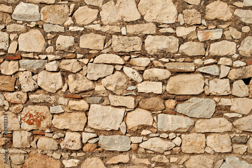 Pattern of old stone wall, surfaced