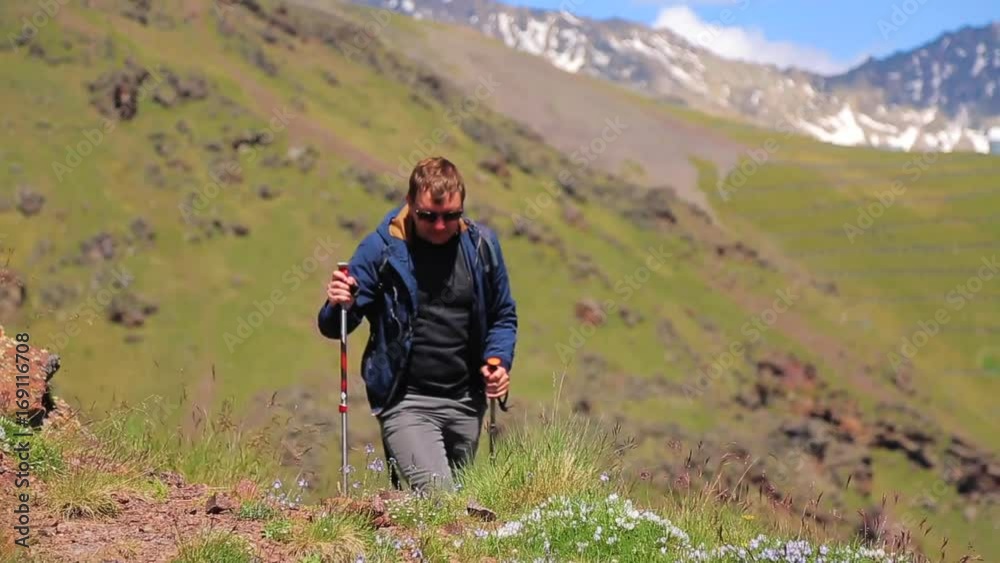 tourist with trekking sticks in the mountains tourist with trekking sticks in the mountains