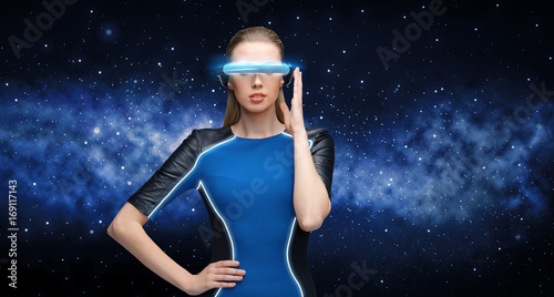 woman in virtual reality 3d glasses over black