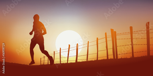 Courir - coureur - footing - jogging - sport -campagne - chemin - coucher de soleil photo