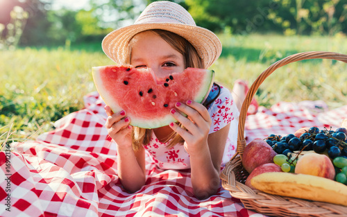 Picnic time. Little girl enjoying in picnic. Nature, lifestyle photo