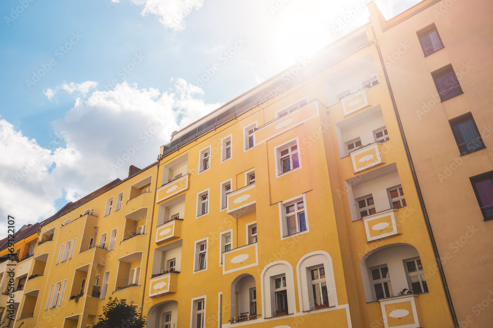 Fototapeta premium colorful picture of apartment building in warm sunlight