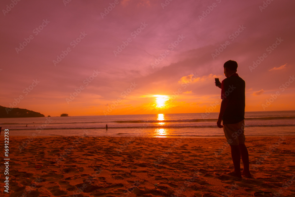 silhoutte man using mobile phone take photo during sunset silhoutte man using mobile phone take photo during sunset