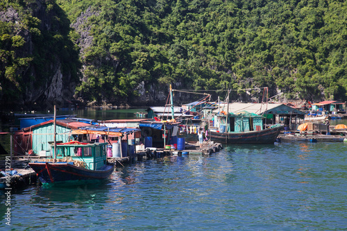 traditional vietnamese boats and floating village among beautiful limestone rocks of Lan Ha bay, the southern edge of Ha Long bay, Vietnam © Melinda Nagy