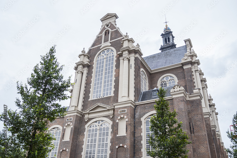 Fototapeta premium Beautiful Church in the city center of Amsterdam - AMSTERDAM - THE NETHERLANDS - JULY 20, 2017