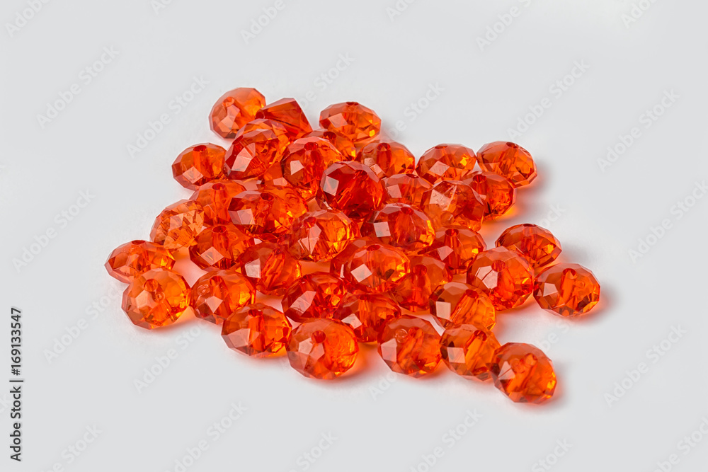 red acrylic beads on a white background red acrylic beads on a white background