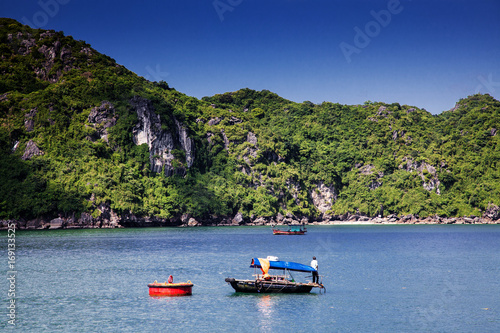boats among beautiful limestone rocks of Lan Ha bay, the twin of Ha Long bay ona sunny day, Vietnam © Melinda Nagy