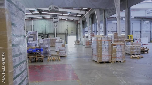 Pallet truck working in warehouse photo