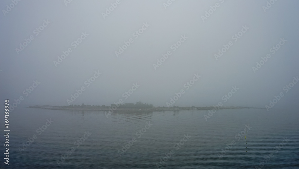 Small islands near Helsinki in the fog Small islands near Helsinki in the fog