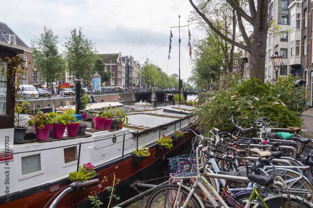 Beautiful House Boats in the canals of Amsterdam - AMSTERDAM - THE NETHERLANDS - JULY 20, 2017