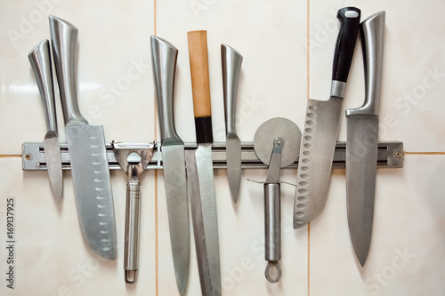 Set of professional knives: paring, Yanagiba, pizza knife, Santoku, carving knife, universal or chef's knife