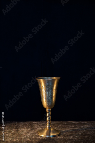 Vintage goblet for wine on black background