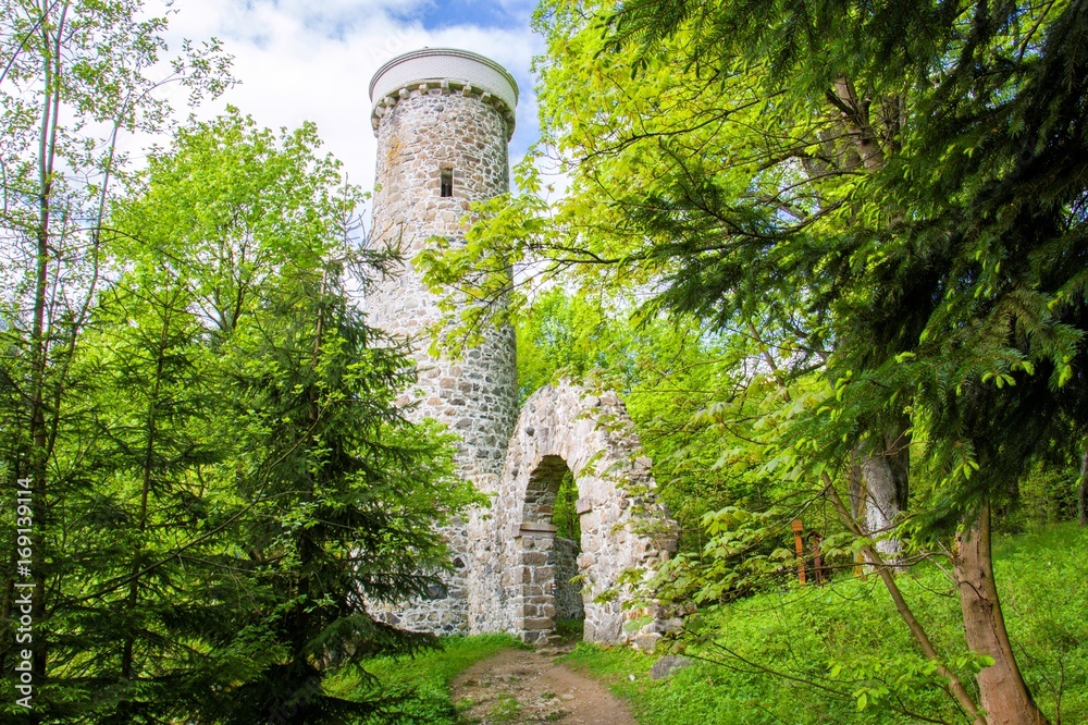 Fototapeta premium Hamelika lookout tower was built in the shape of a romantic ruin - Marianske Lazne (Marienbad) - great famous Bohemian spa town in the west part of the Czech Republic (region Karlovy Vary)