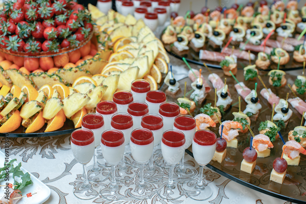 Candy bar with fresh summer fruits prepared for reception