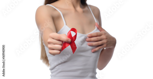 Healthcare and medicine concept - woman holding red AIDS HIV awareness ribbon