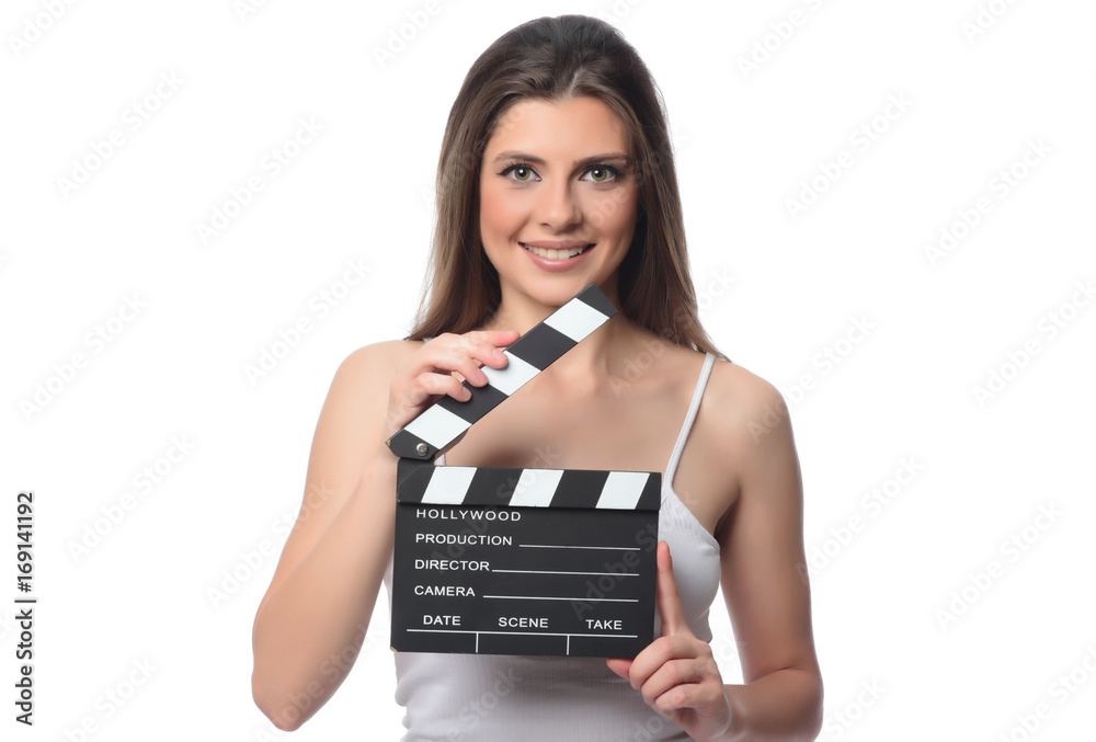 beautiful young woman with cinema clapper posing in studio. Movie concept. isolated beautiful young woman with cinema clapper posing in studio. Movie concept. isolated