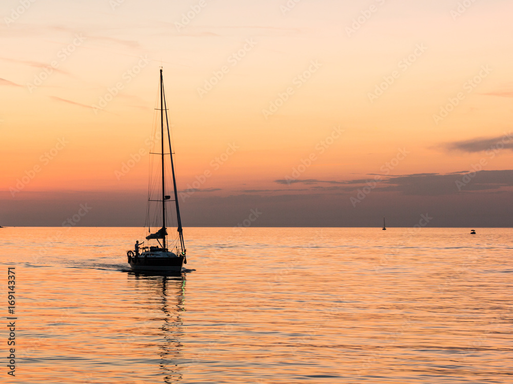 yacht with beautiful orange sea sunset