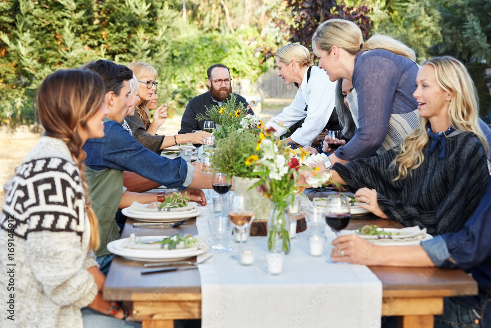 Caterers bringing food to Farm to Table Dinner Party Caterers bringing food to Farm to Table Dinner Party
