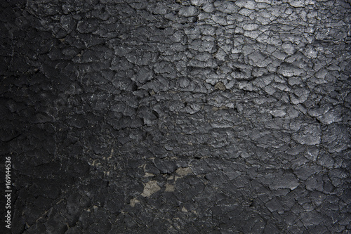 Closeup of old flaking black bonded leather chair