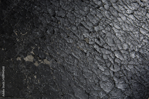 фотографія Closeup of old flaking black bonded leather chair