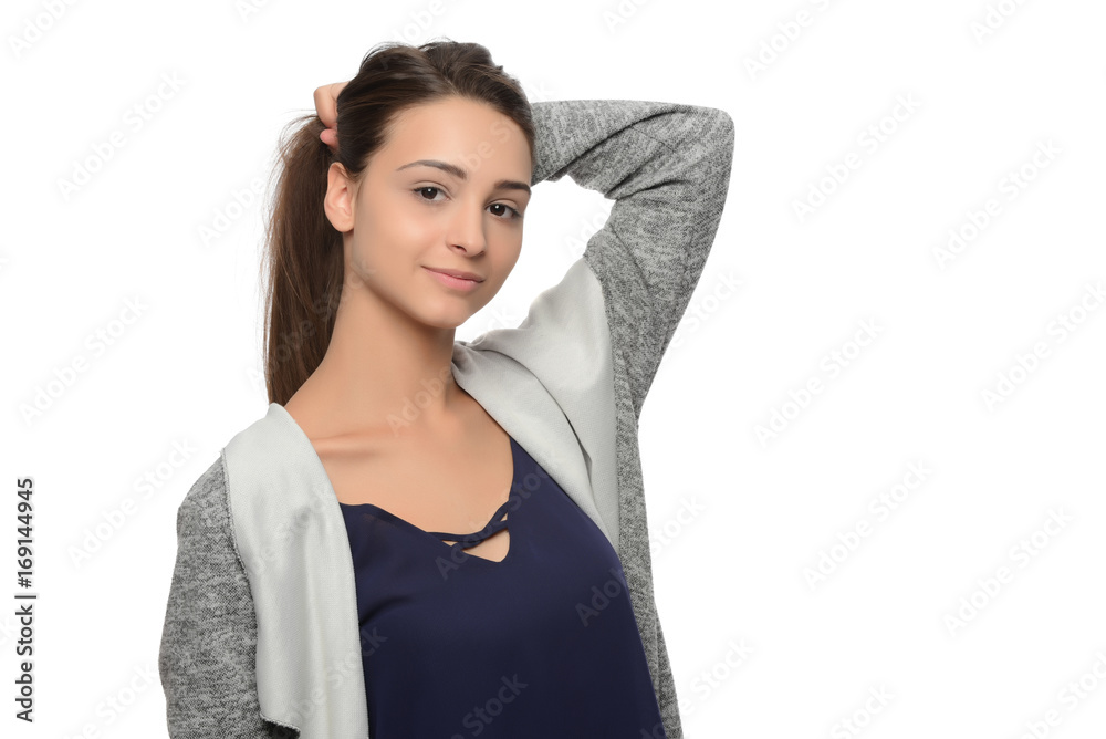 A young beautiful woman touching her hair. isolated A young beautiful woman touching her hair. isolated
