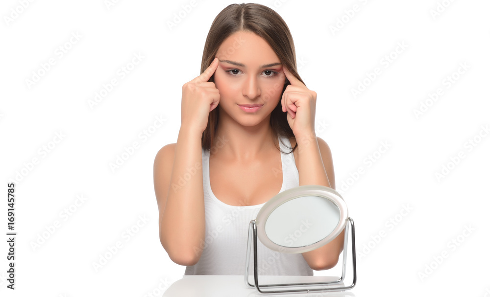 beautiful young female checking her facde skin beautiful young female checking her facde skin