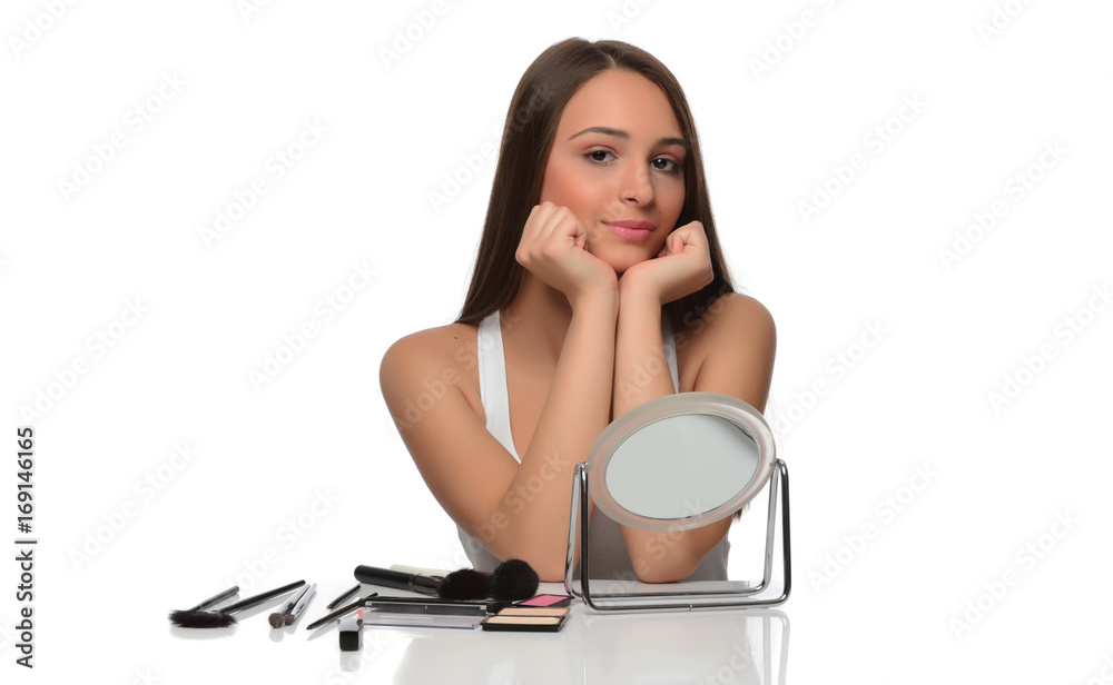 beautiful young female checking her facde skin beautiful young female checking her facde skin