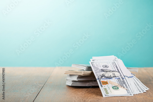 Thousands of USA dollars cash money on table