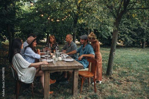Group of friends making a dinner party photo