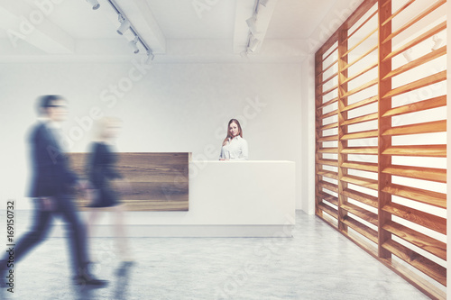 White and wooden reception, secretary