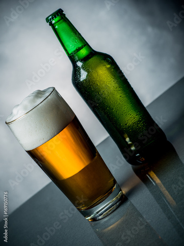 Composition of beer glass and some bottles
