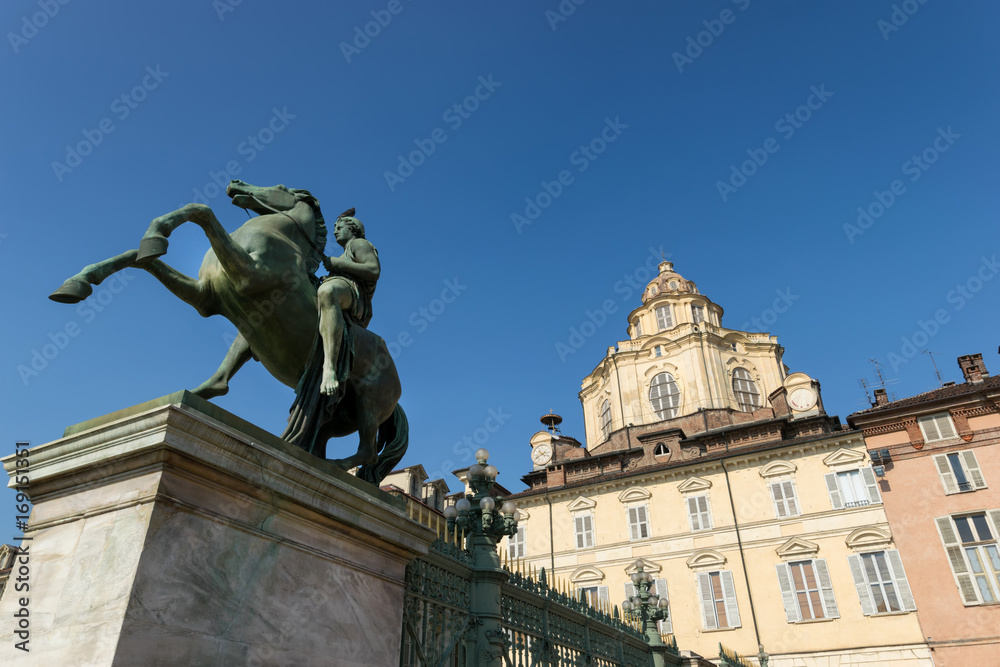 Castor equestrian statue and San Lorenzo church in Turin, Italy