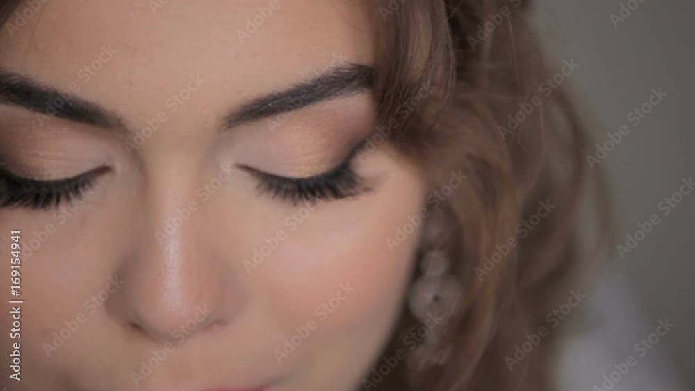 Portrait of a beautiful sensual girl on a white background. Close Up. Portrait of the girl's eyes close-up (macro) Portrait of a beautiful sensual girl on a white background. Close Up. Portrait of the girl's eyes close-up (macro)