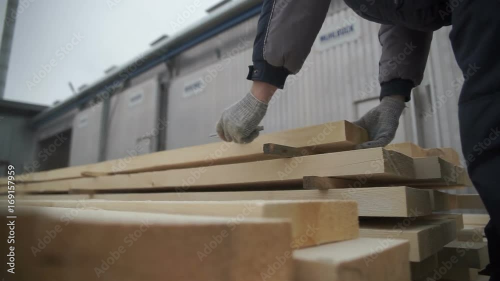 Hands of the master cut tree, woodworking Hands of the master cut tree, woodworking