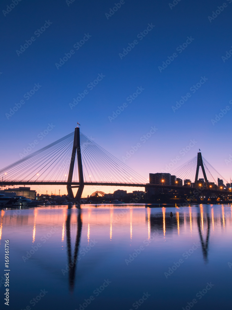 Blue hour at Anzac bridge with its reflection, Sydney, Australia.